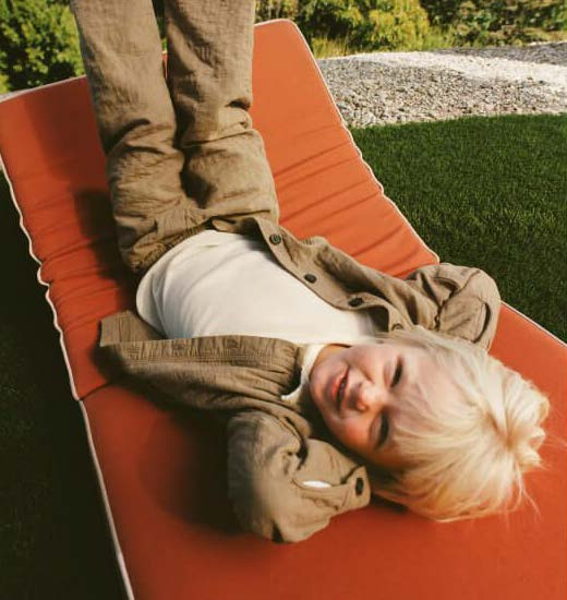 Boy lying on red mat